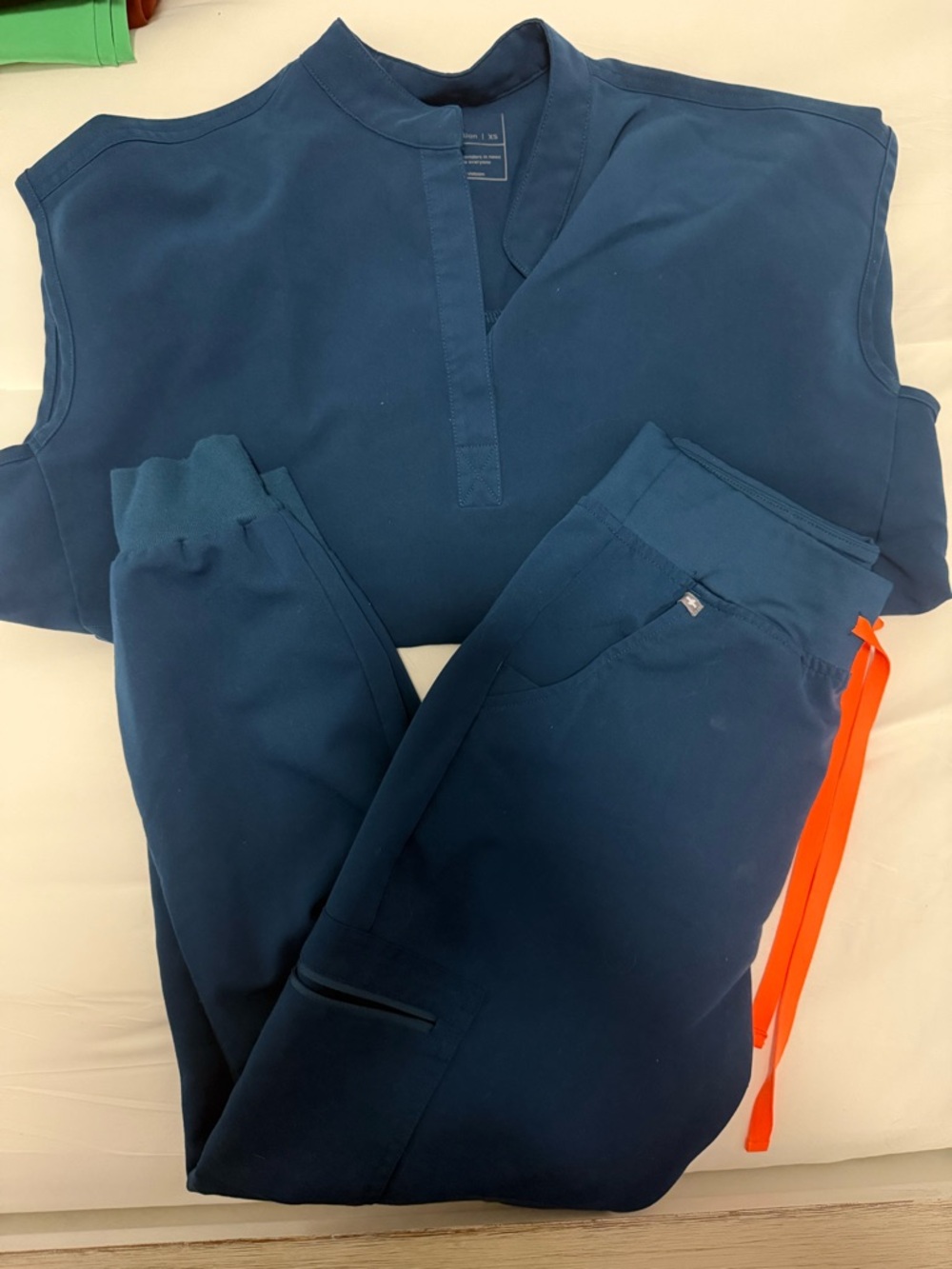 Figs Technical Scrub Top in Teal with Orange Drawstring